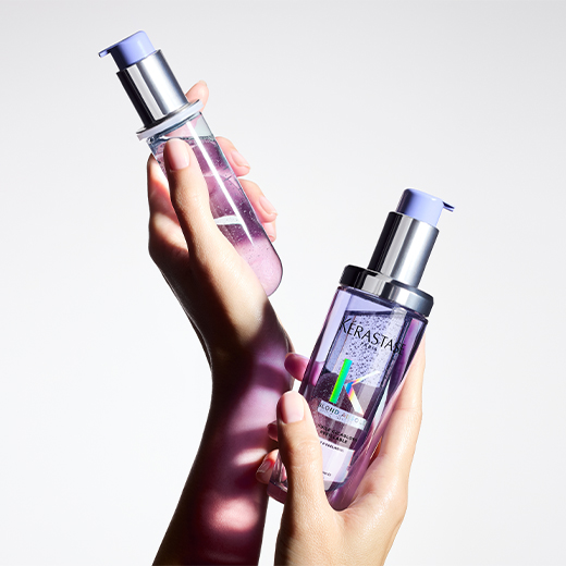 Blonde model with her gorgeous blonde hair holds the best hair oil for blonde hair Blond Absolu Huile Cicaextreme.